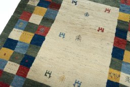 Backside of handmade New Persian Gabbeh rug showing knot structure and weave density