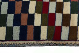 Close-up detail of 2000s Persian Gabbeh rug from Iran / Persia showing Wool weave