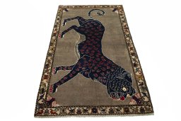 Surface texture of 2000s Persian Gabbeh rug with natural Wool and intricate pattern
