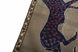 Backside of handmade 2000s Persian Gabbeh rug showing knot structure and weave density