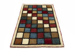 Surface texture of 2000s Persian Gabbeh rug with natural Wool and intricate pattern