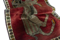 Corner detail of 2000s Persian Gabbeh rug showing border pattern and Wool pile