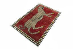 Corner detail of 2000s Persian Gabbeh rug showing border pattern and Wool pile