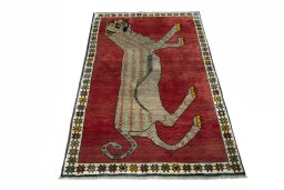 Surface texture of 2000s Persian Gabbeh rug with natural Wool and intricate pattern
