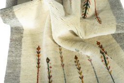 Corner detail of New Persian Gabbeh rug showing border pattern and Wool pile