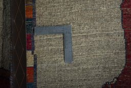 Close-up detail of 2000s Persian Gabbeh rug from Iran / Persia showing Wool weave