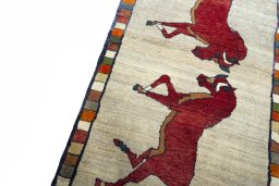 Backside of handmade 2000s Persian Gabbeh rug showing knot structure and weave density