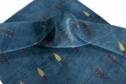 Corner detail of New Persian Gabbeh rug showing border pattern and Wool pile