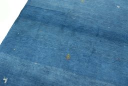 Backside of handmade New Persian Gabbeh rug showing knot structure and weave density