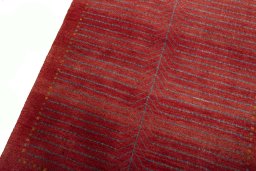 Backside of handmade New Persian Gabbeh rug showing knot structure and weave density