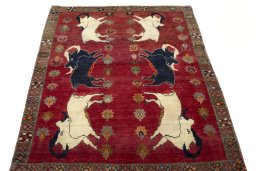 Surface texture of 2000s Persian Gabbeh rug with natural Wool and intricate pattern