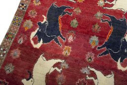 Backside of handmade 2000s Persian Gabbeh rug showing knot structure and weave density