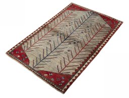 Corner detail of 2000s Persian Gabbeh rug showing border pattern and Wool pile