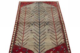 Surface texture of 2000s Persian Gabbeh rug with natural Wool and intricate pattern