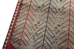 Backside of handmade 2000s Persian Gabbeh rug showing knot structure and weave density