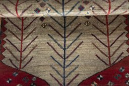 Full view of 2000s Persian Gabbeh rug from Iran / Persia, 150 × 100 cm in Beige tones
