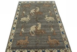 Surface texture of 2000s Persian Gabbeh rug with natural Wool and intricate pattern