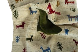 Corner detail of 2000s Persian Gabbeh rug showing border pattern and Wool pile