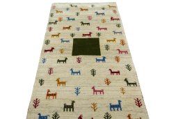 Surface texture of 2000s Persian Gabbeh rug with natural Wool and intricate pattern