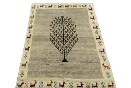 Surface texture of 2000s Persian Gabbeh rug with natural Wool and intricate pattern