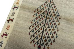 Backside of handmade 2000s Persian Gabbeh rug showing knot structure and weave density