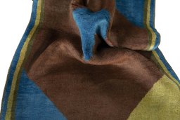 Corner detail of 2000s Persian Gabbeh rug showing border pattern and Wool pile