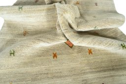 Corner detail of New Persian Gabbeh rug showing border pattern and Wool pile