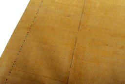 Backside of handmade New Persian Gabbeh rug showing knot structure and weave density