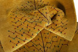 Corner detail of New Persian Gabbeh rug showing border pattern and Wool pile