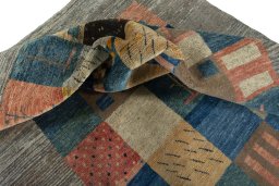 Corner detail of New Persian Gabbeh rug showing border pattern and Wool pile