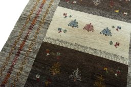 Backside of handmade New Persian Gabbeh rug showing knot structure and weave density