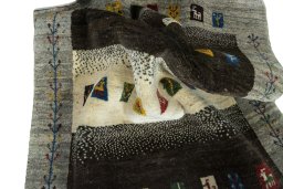 Corner detail of New Persian Gabbeh rug showing border pattern and Wool pile