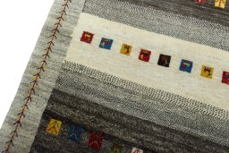 Backside of handmade New Persian Gabbeh rug showing knot structure and weave density