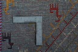 Corner detail of New Persian Gabbeh rug showing border pattern and Wool pile