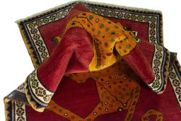 Corner detail of 2000s Persian Gabbeh rug showing border pattern and Wool pile