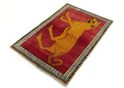 Corner detail of 2000s Persian Gabbeh rug showing border pattern and Wool pile