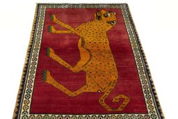 Surface texture of 2000s Persian Gabbeh rug with natural Wool and intricate pattern