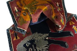 Corner detail of 2000s Persian Gabbeh rug showing border pattern and Wool pile