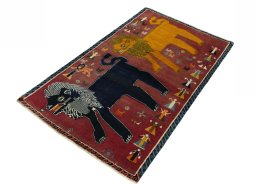 Corner detail of 2000s Persian Gabbeh rug showing border pattern and Wool pile