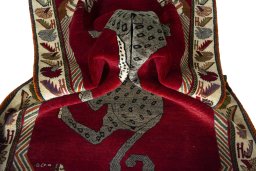 Corner detail of 2000s Persian Gabbeh rug showing border pattern and Wool pile