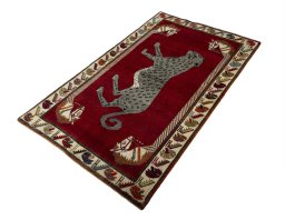 Corner detail of 2000s Persian Gabbeh rug showing border pattern and Wool pile
