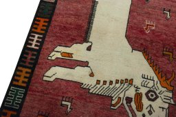Backside of handmade 2000s Persian Gabbeh rug showing knot structure and weave density