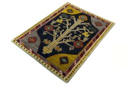 Corner detail of 2000s Persian Gabbeh rug showing border pattern and Wool pile