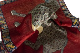 Corner detail of 2000s Persian Gabbeh rug showing border pattern and Wool pile