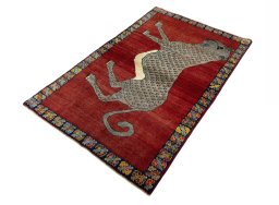 Corner detail of 2000s Persian Gabbeh rug showing border pattern and Wool pile