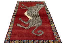 Surface texture of 2000s Persian Gabbeh rug with natural Wool and intricate pattern