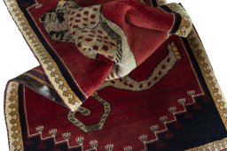 Corner detail of 2000s Persian Gabbeh rug showing border pattern and Wool pile