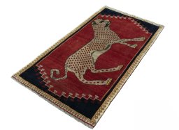 Corner detail of 2000s Persian Gabbeh rug showing border pattern and Wool pile