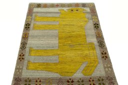 Surface texture of 2000s Persian Gabbeh rug with natural Wool and intricate pattern