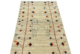 Surface texture of 2000s Persian Gabbeh rug with natural Wool and intricate pattern